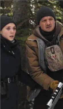  ??  ?? Elizabeth Olsen and Jeremy Renner in Wind River.