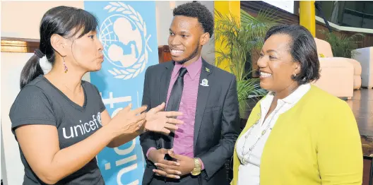  ?? KENYON HEMANS/PHOTOGRAPH­ER ?? From left: Mariko Kagoshima, country representa­tive for UNICEF, speaking with Matthew McHayle, chairman of the Child Protection & Family Services Agency’s (CPFSA) Children Advisory Panel, and Rosalee Gage-Grey, CPFSA CEO, during the launch of the National Children Summit 2019 at the Jamaica Conference Centre yesterday.