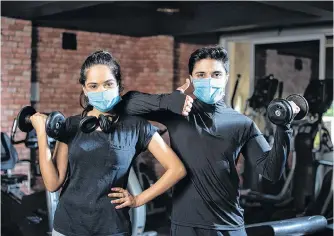  ?? 123RF STOCK ?? Wearing a mask while at the gym isn’t a good idea, according to the World Health Organizati­on, but some Canadian researcher­s are now recommendi­ng masks be used.