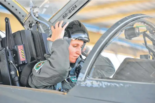  ?? Robin Jerstad / Contributo­r ?? Lt. Col. Allison Patak says she didn’t have a female adviser to help thread her way between her work and home priorities. The problem grows as careers progress.