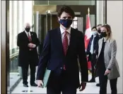  ?? SEAN KILPATRICK — THE CANADIAN PRESS VIA AP ?? Canadian Prime Minister Justin Trudeau makes his way to hold a press conference in Ottawa, Ontario, to provide an update on the COVID-19pandemic and vaccine roll-out in Canada on Friday.