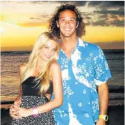  ??  ?? MAKING WAVES: Jordy Smith and his supermodel fiancée, Lyndall Jarvis; and, right, Smith in action off the island of Reunion