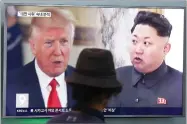  ?? AP PHOTO BY AHN YOUNG-JOON ?? A man watches a television screen showing President Donald Trump and North Korean leader Kim Jong Un during a news program at the Seoul Train Station in Seoul, South Korea, Thursday.