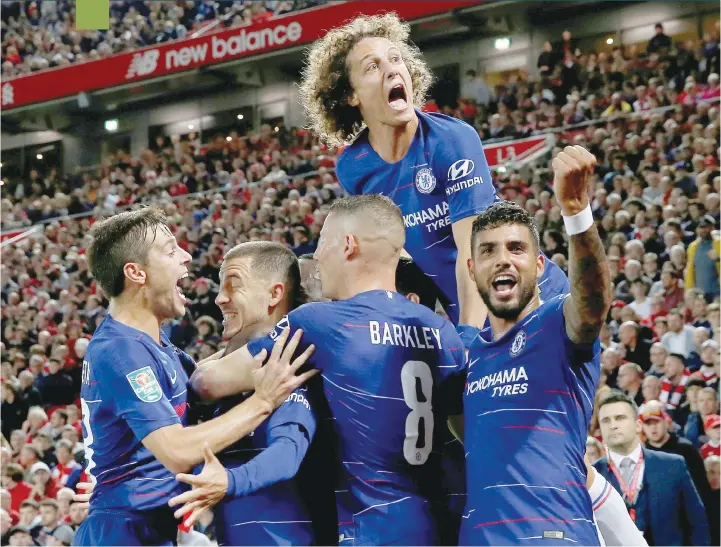  ?? — Reuters ?? Chelsea’s Eden Hazard celebrates with Cesar Azpilicuet­a, Ross Barkley, Emerson Palmieri and David Luiz after scoring their second goal.