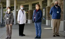  ?? LAUREN A. LITTLE — MEDIANEWS GROUP ?? Penn State Health St. Joseph hospital chaplains, from left, Joyce Martin, Rose Teresa Dvorak, Susan Horst and Thomas Devaney outside the hospital. The COVID-19 crisis has “taken active listening to a whole new level,” Devaney says of his work.