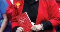  ??  ?? A WOMAN HOLDS a copy of the Labour Party’s election manifesto yesterday during a rally in Huddersfie­ld, where party leader Jeremy Corbyn addressed the crowd.