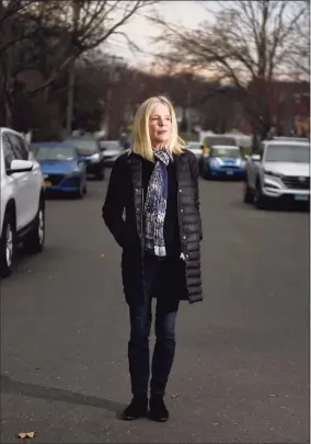  ?? Tyler Sizemore / Hearst Connecticu­t Media ?? Dede Yoder poses outside of her home in Norwalk. Yoder’s son, Chris, died of an overdose of fentanyl and carfentani­l in 2017. He was prescribed the painkiller OxyContin for a series of injuries in his early teens, and his mother believes that his OxyContin prescripti­on acted as a gateway for him to start using heroin.