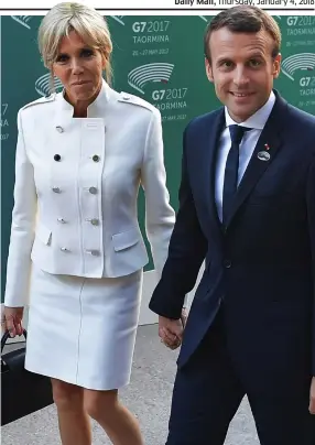  ??  ?? In step: French president Emmanuel Macron and first lady Brigitte