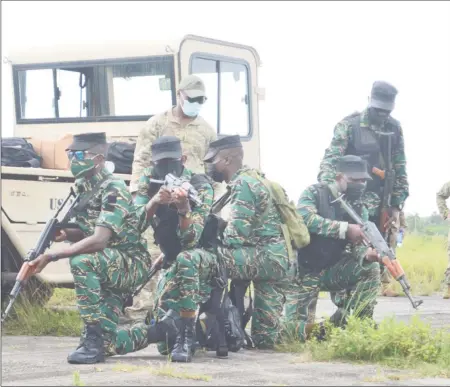  ??  ?? GDF ranks positionin­g themselves during a drill exercise at Camp London yesterday as training continued under the US Southern Command-sponsored Tradewinds 21 military exercise. (Orlando Charles photo)