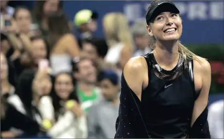  ?? Picture: EPA ?? CAN I BE HAPPY? Maria Sharapova is all smiles after upsetting second seed Simona Halep at the US Open.