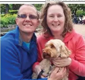  ??  ?? Prized pet: Cockapoo Izzy with owners Ian and Dawn Purvis