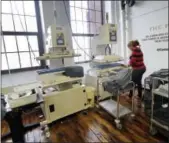  ?? ELISE AMENDOLA — THE ASSOCIATED PRESS ?? A woman works with fabric at 99Degrees Custom, an apparel manufactur­er specializi­ng in sewn and bonded sports and activewear, in Lawrence, Mass.
