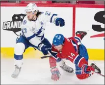  ??  ?? Tampa Bay Lightning defenseman Ryan McDonagh (27) takes down Montreal Canadiens center Nick Suzuki during the second period of Game 3 of the NHL hockey Stanley Cup Final, on July 2, in Montreal. (AP)