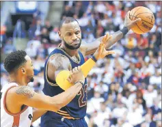  ??  ?? Cleveland Cavaliers’ Lebron James controls the ball during the playoff game against Toronto Raptors at Air Canada Centre. — AFP photo