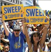  ?? JUSTIN SULLIVAN / GETTY IMAGES ?? Golden State Warriors fans should hang on to those signs because they likely will be celebratin­g another NBA title next June.