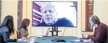  ?? REUTERS ?? Britain’s Prime Minister Boris Johnson appears on a monitor for a meeting in London on Saturday.