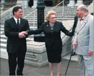  ?? DOUGLAS ASKMAN / IOLANI PALACE VIA AP ?? Abigail Kawananako­a (center) meets the King of Tonga (right) as Executive Director Kippen de Alba Chu looks on outside the palace in Honolulu In 2010.