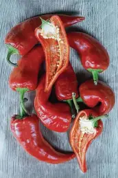  ?? Paul Stephen / Staff ?? Fresno chiles, often mistaken for jalapeños, are fruity and sweet, with a mild smokiness that’s ideal for sauces.