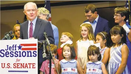  ?? JULIE BENNETT AP ?? Former U.S. Attorney General Jeff Sessions, joined by family members, delivers his concession speech Tuesday in Mobile, Ala. Sessions lost the Republican nomination for his old Senate seat to former college football coach Tommy Tuberville.