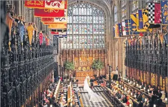  ??  ?? Harry and Meghan at the altar during their wedding service