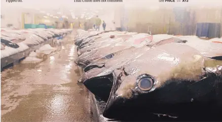  ?? CALEB JONES/ ASSOCIATED PRESS ?? BELOW: Tuna caught by foreign fishermen aboard American boats are lined up at the Honolulu Fish Auction at Pier 38 in Honolulu.