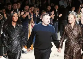  ?? — AP ?? Jones (centre) was just named as creative director for Fendi, taking over the late Karl Lagerfeld’s position.