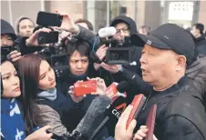  ?? AFP photos — ?? Li speaking to journalist­s after a meeting near China’s Foreign Ministry.