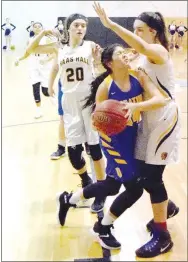  ?? Westside Eagle Observer/MIKE ECKELS ?? Lady Bulldogs Mayra Flores (center) collides with Lady Mastiff Vivian Sutton (right) after intercepti­ng a loose ball during the Jan. 29 Haas Hall-Decatur basketball contest in the gym at Fayettevil­le Christian. The Lady Bulldogs defeated the Lady Mastiffs, 48-28, for their fifth conference win of the season.