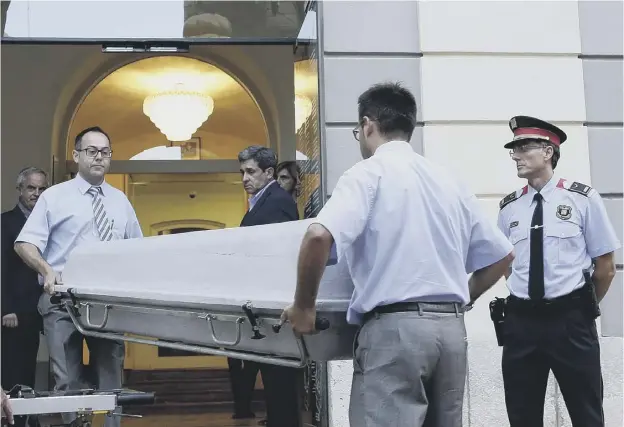  ?? PICTURE: MANU FERNANDEZ/AP ?? Workers move Salvador Dali’s coffin at the Dali Museum Theatre in the north-eastern Spanish town of Figueres