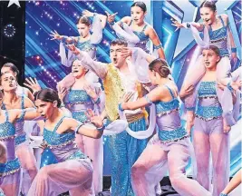  ?? ?? Razzle dazzle The lively performanc­e got the cast through to the next stage