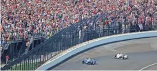  ?? MARK J. REBILAS, USA TODAY SPORTS ?? Takuma Sato leads Helio Castroneve­s on the final lap en route to winning the 101st Indianapol­is 500.