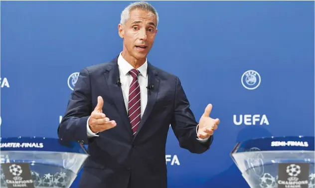  ?? Agence France-presse ?? Former Portuguese player Paulo Sousa speaks during the UEFA Champions League draw ceremony in Nyon on Friday.