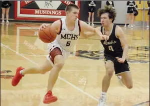  ?? GRAHAM THOMAS/MCDONALD COUNTY PRESS ?? Cross Dowd drives to the basketball in a game against Neosho earlier this season at Mustang Arena.