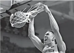  ?? Associated Press ?? ■ Texas Tech's Zhaire Smith (2) dunks the ball during the first half of an NCAA college basketball game against TCU on Saturday in Lubbock, Texas.