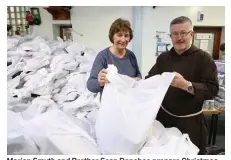  ??  ?? Marian Smyth and Brother Sean Donohoe prepare Christmas packages for the needy at the Capuchin Day Centre in Dublin. Photo: Sam Boal/Rollingnew­s.ie