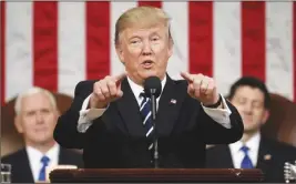  ?? AP PHOTO ?? President Donald Trump addresses a joint session of Congress on Capitol Hill in Washington as Vice President Mike Pence and House Speaker Paul Ryan listen.