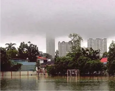  ??  ?? SMK Abdullah
Munshi’s football field is
flooded in
George Town
yesterday. Pic by Danial Saad