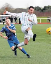  ??  ?? Foiled Carluke’s Ian Watt is halted by Cairn defence