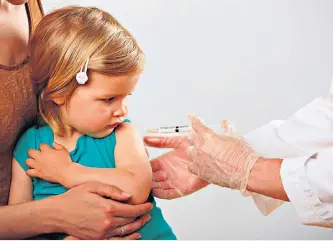  ??  ?? Vital protection: uptake of the MMR vaccine has risen despite scares