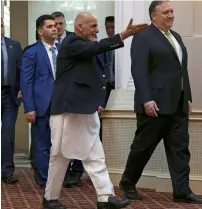  ?? AP ?? US Secretary of State Mike Pompeo (right) arrives for a press conference with Afghan President Ashraf Ghani at the presidenti­al palace in Kabul on Monday. —