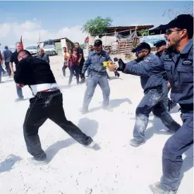  ?? Reuters ?? Israeli police disperse activists in the Palestinia­n Bedouin village of Khan Al Ahmar in West Bank on Wednesday.UNITED