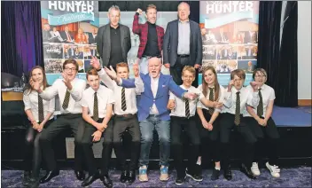  ??  ?? The Arran pupils with Sir Tom Hunter and other judges.