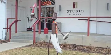  ?? ANNE SCHAMBERG ?? Visitors to Studio Winery in Lake Geneva are greeted by this sculpture, created by Burlington artist Brady Lueck. He's nicknamed "Cork Dork."