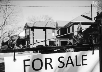  ?? GRAEME ROY
THE CANADIAN PRESS ?? April home sales dropped to a seven-year low for the month, the kick-off to the busy spring real estate season, as both sales and prices saw double-digit annual declines.