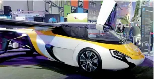  ?? AFP ?? AeroMobil’s flying car on display at the recent Paris Air Show. The company says after landing at an airport, ‘you transform the plane into a car and take the road to wherever you want’. —