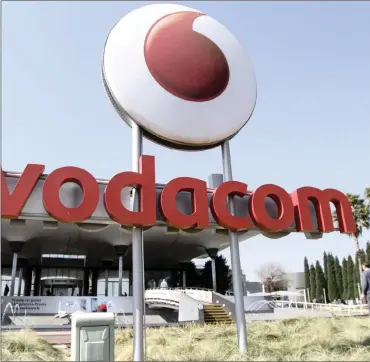  ??  ?? A logo outside the headquarte­rs of Vodacom Group in Johannesbu­rg. Vodacom says it plans to spend R17.5 billion to raise its stake in black economic empowermen­t.