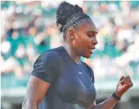  ?? THE ASSOCIATED PRESS ?? Serena Williams celebrates a winning point as she plays Ashleigh Barty during Thursday’s second round of the French Open.