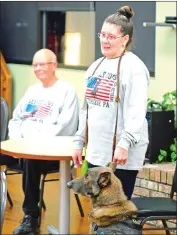  ?? Photo by Tribune-Review ?? Debbie Richey speaks about her service dog, Navy, as Bill Jeffcoat observes during a Plum Area Ladies Society meeting on Feb. 1, 2023, at the Plum Community Center.