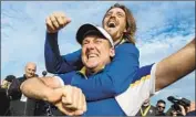  ?? Richard Heathcote Getty Images ?? EUROPEAN team members Ian Poulter, front, and Tommy Fleetwood celebrate their Ryder Cup win.