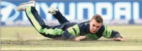  ?? Picture: GETTY IMAGES ?? DOWN AND OUT: Andrew McBrine of Ireland dives to field a ball off his own bowling during the World Cup match against the Proteas this week... but Ireland and the other “Associate Nations” are not being looked after properly by the ICC.